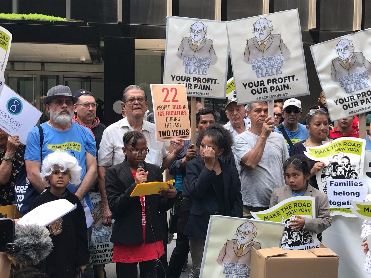 Children don costumes to find JPMorgan "guilty" of conspiring with ICE in a Tuesday protest.